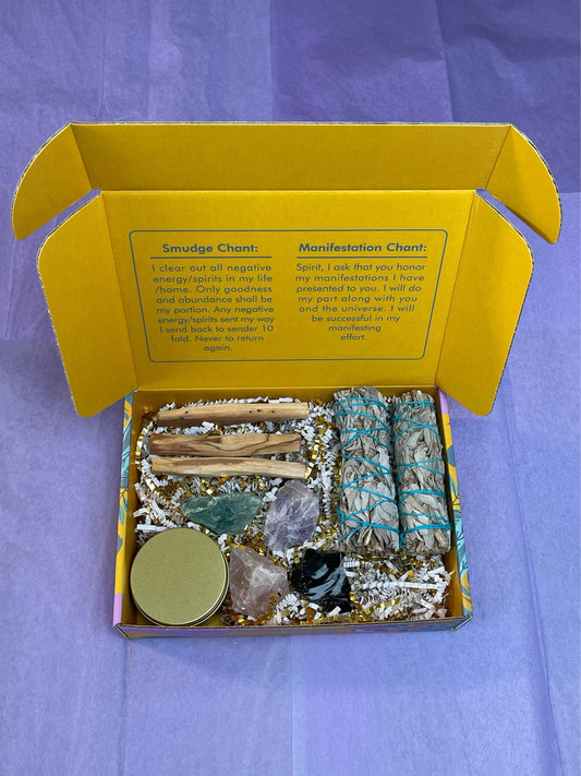 The Energy Cleansing and Healing Box contains (1) Higher Self Scented Candle (2) White Sage (3) Palo Santo (4) Energy Healing Crystals